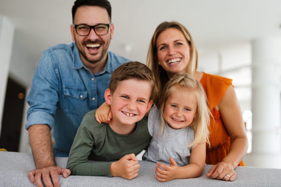 A happy family laughing together at home
